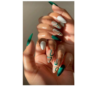 A girl showing her manicure with stickers printed by phomemo label maker.